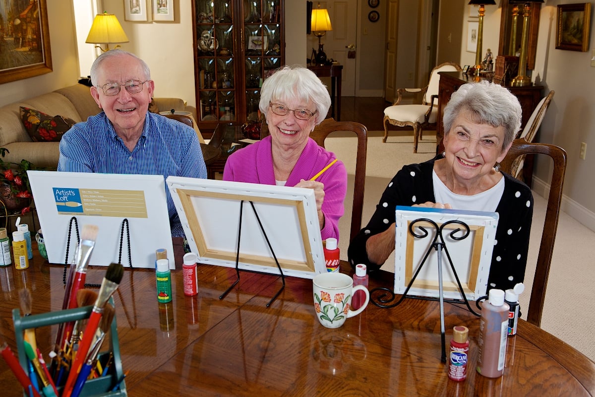 Senior friends painting