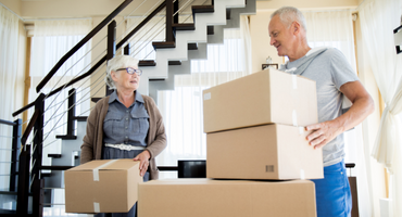 Woman and man packing boxes